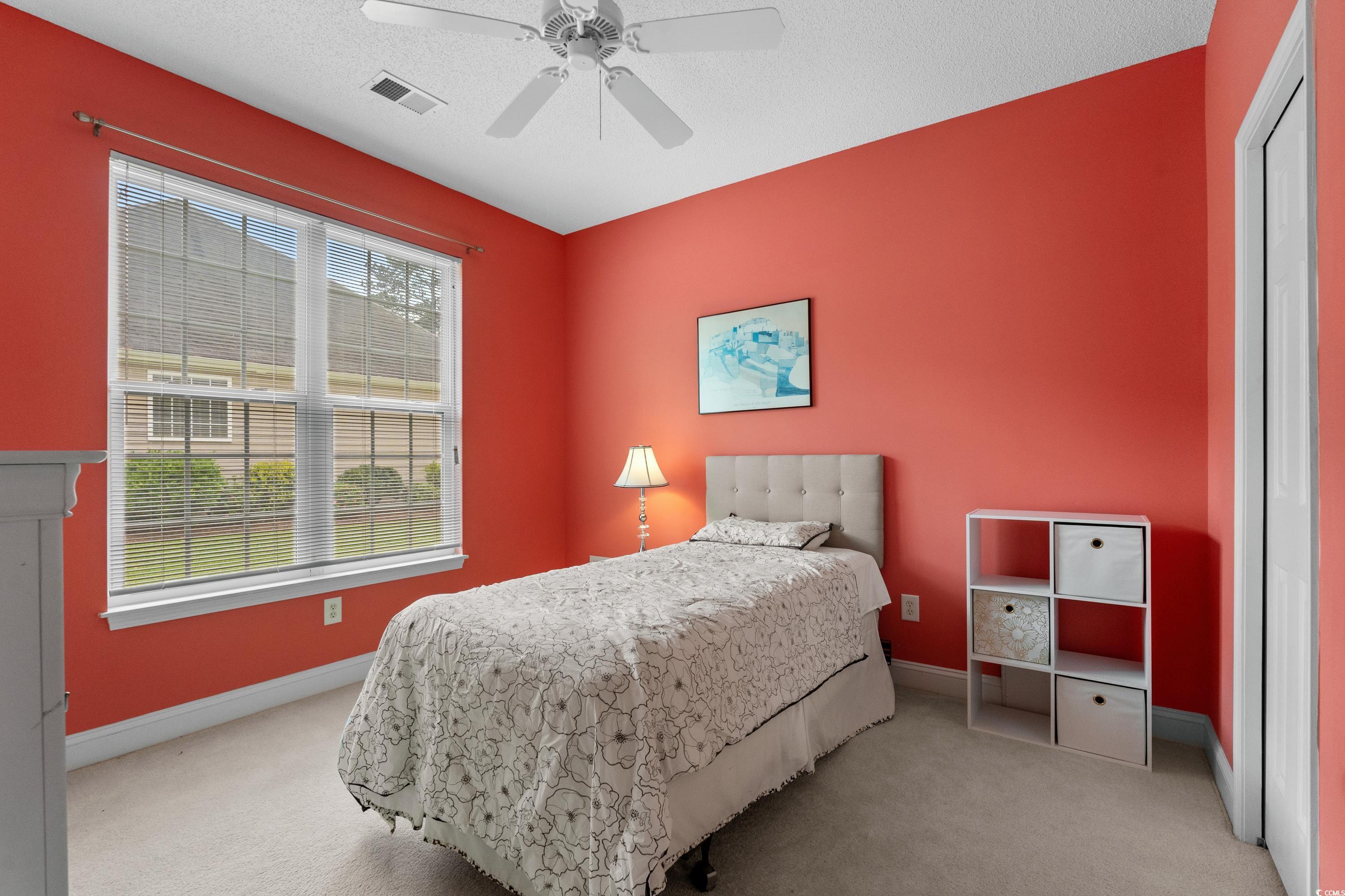 5025 Westwind Drive Myrtle Beach, SC 29579 - Photo 34 of 36 Carpeted bedroom featuring baseboards, a ceiling f