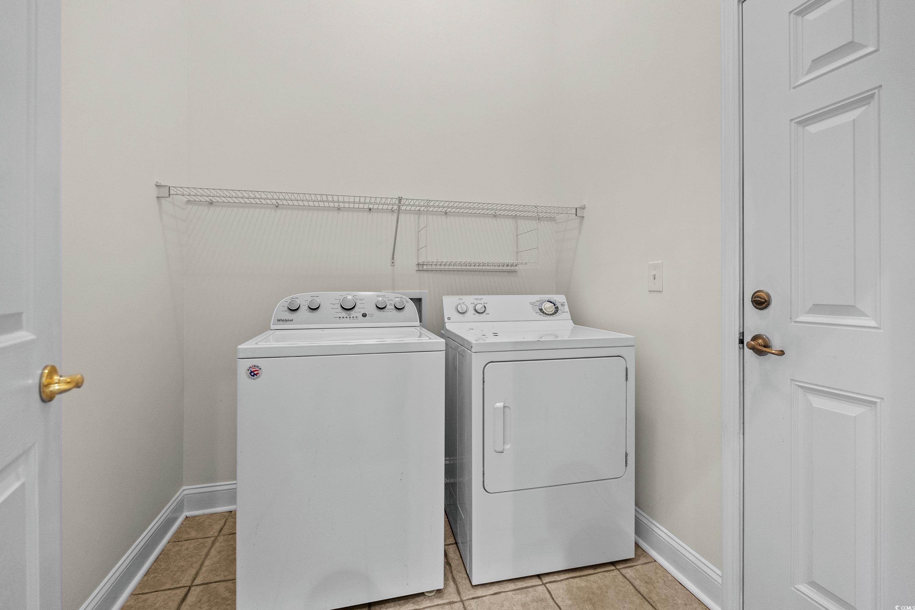 5025 Westwind Drive Myrtle Beach, SC 29579 - Photo 36 of 36 Washroom with washer and dryer, light tile pattern