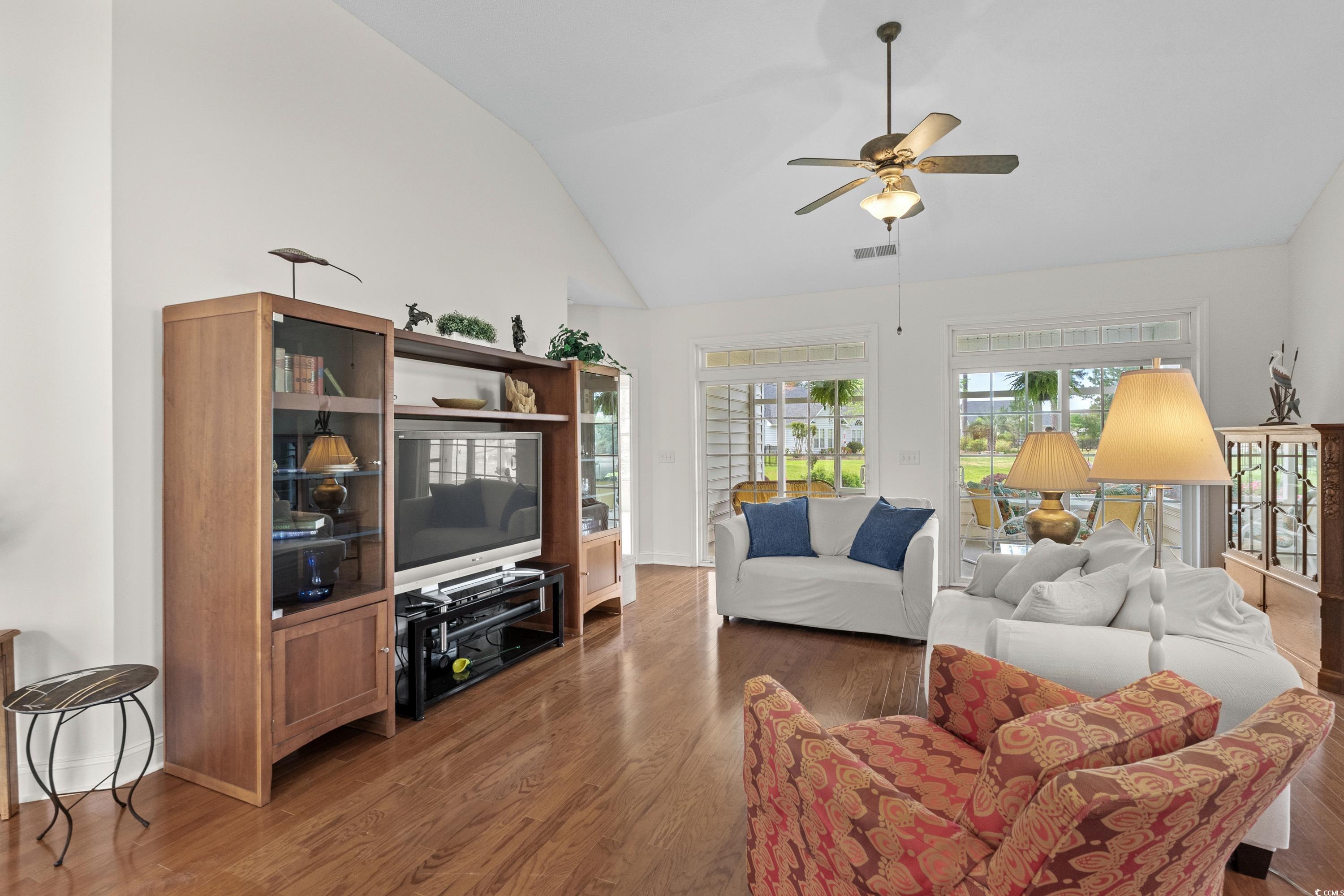 5025 Westwind Drive Myrtle Beach, SC 29579 - Photo 7 of 36 Living area featuring wood finished floors, visibl