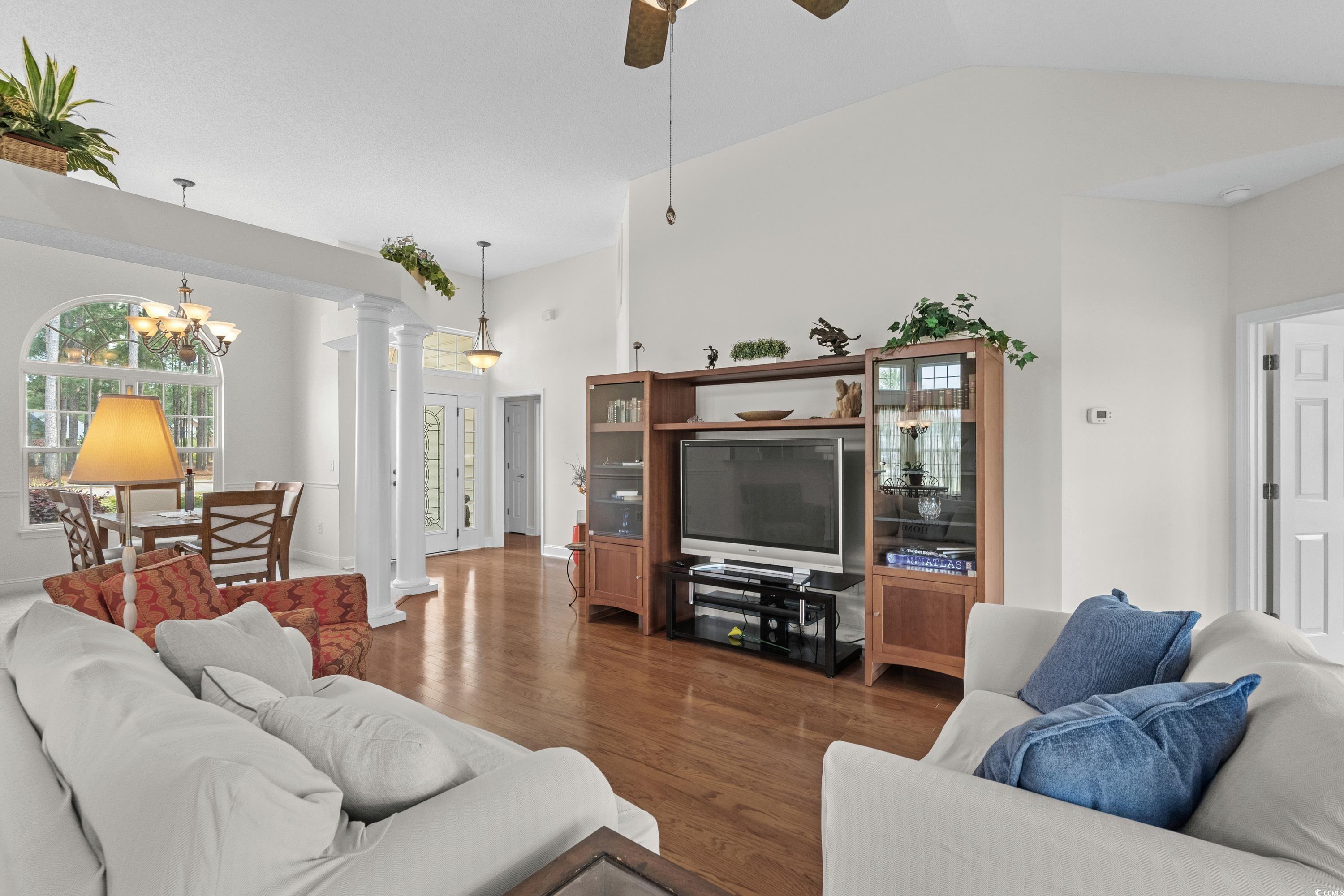 5025 Westwind Drive Myrtle Beach, SC 29579 - Photo 8 of 36 Living area featuring dark wood-type flooring, orn
