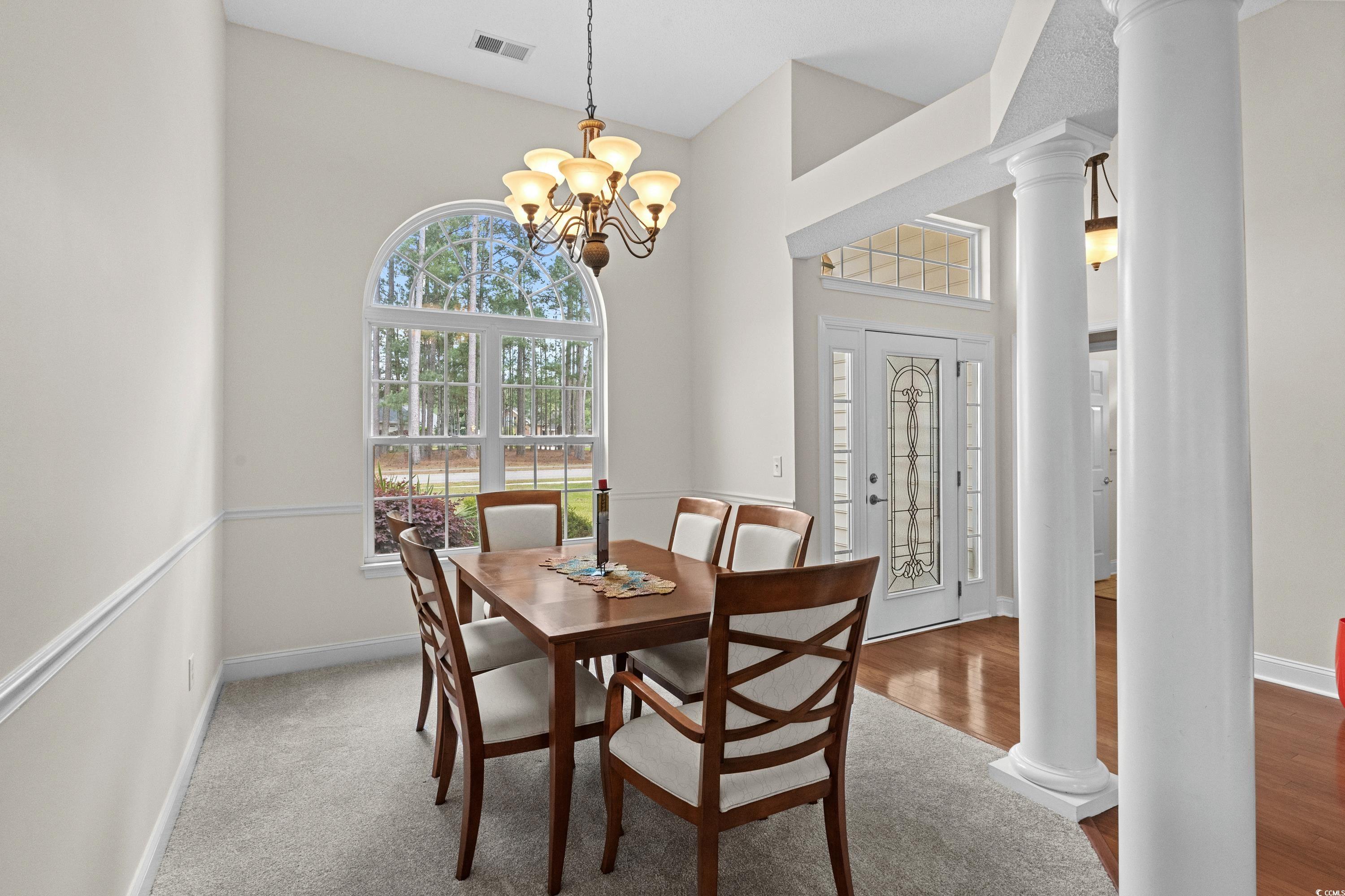 5025 Westwind Drive Myrtle Beach, SC 29579 - Photo 10 of 36 Dining space with visible vents, decorative column