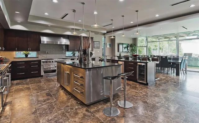 a bedroom with furniture and a large window