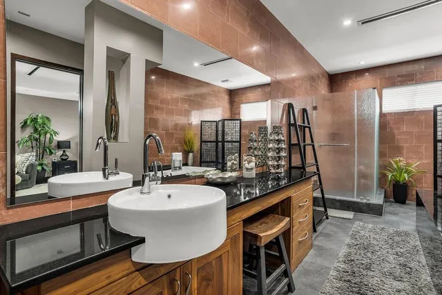 a room with pool table and windows