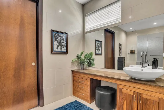 a view of a house with swimming pool and sitting area