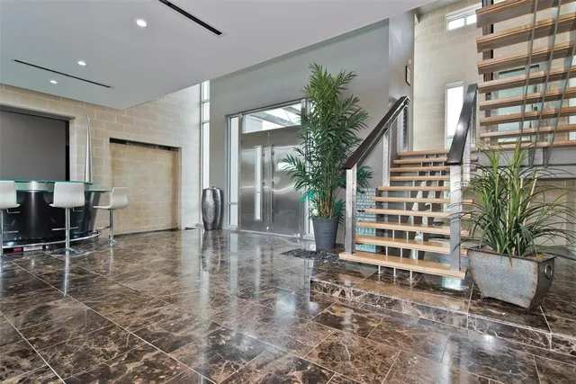 a living room with furniture dining area and a rug