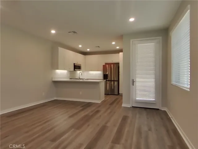 a view of kitchen with wooden floor