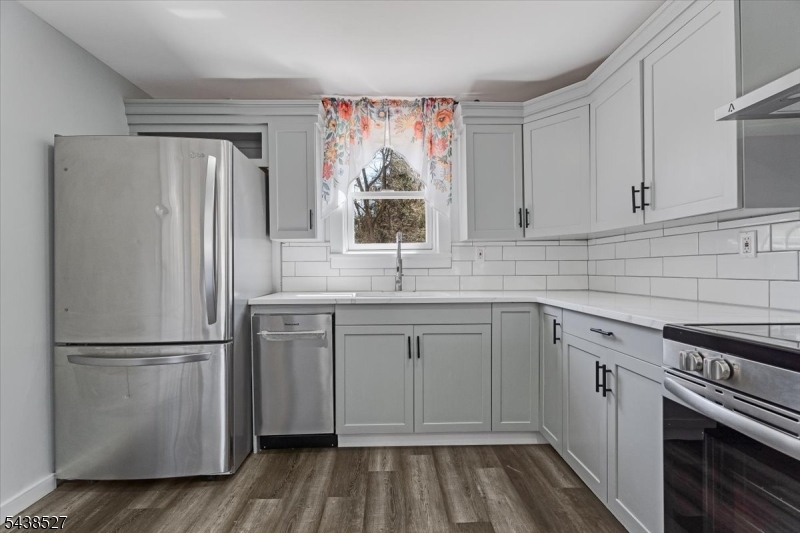83 Highway 15 Lafayette, NJ 07848 - Photo 4 of 20 a kitchen with a refrigerator stove and sink