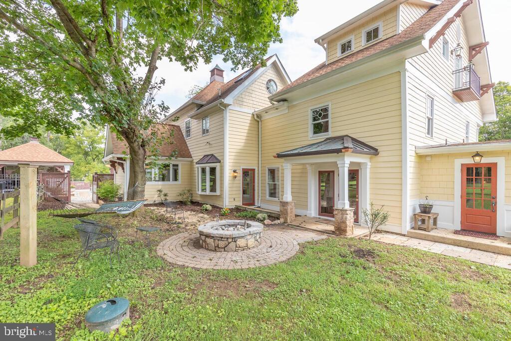 14498 Triadelphia Mill Road Dayton, MD 21036 - Photo 74 of 97 side view firepit and laundry room entry