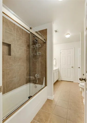 a bathroom with a shower and a bathtub