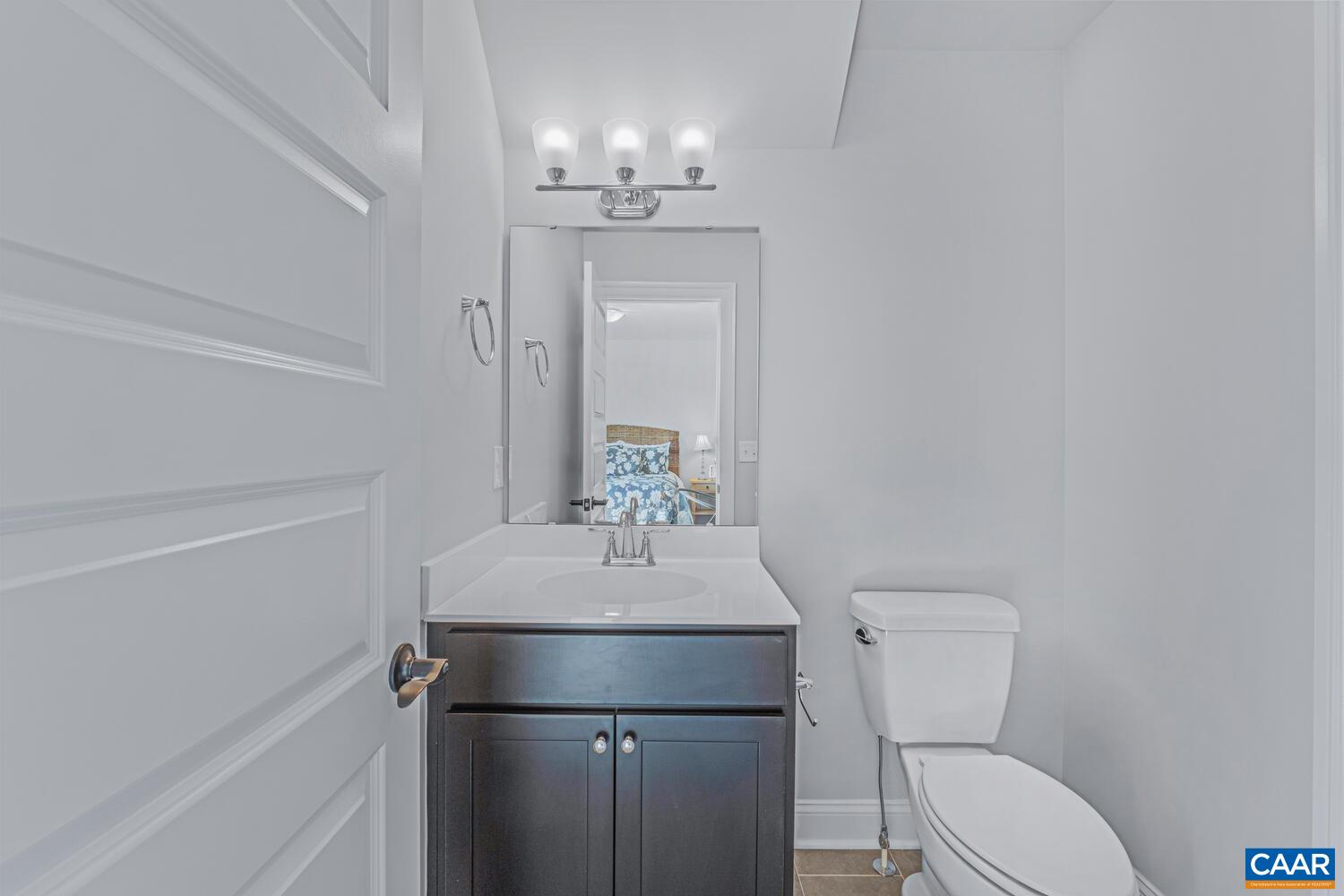 1731 Fowler Street Charlottesville, VA 22901 - Photo 36 of 45 a bathroom with a sink toilet and mirror