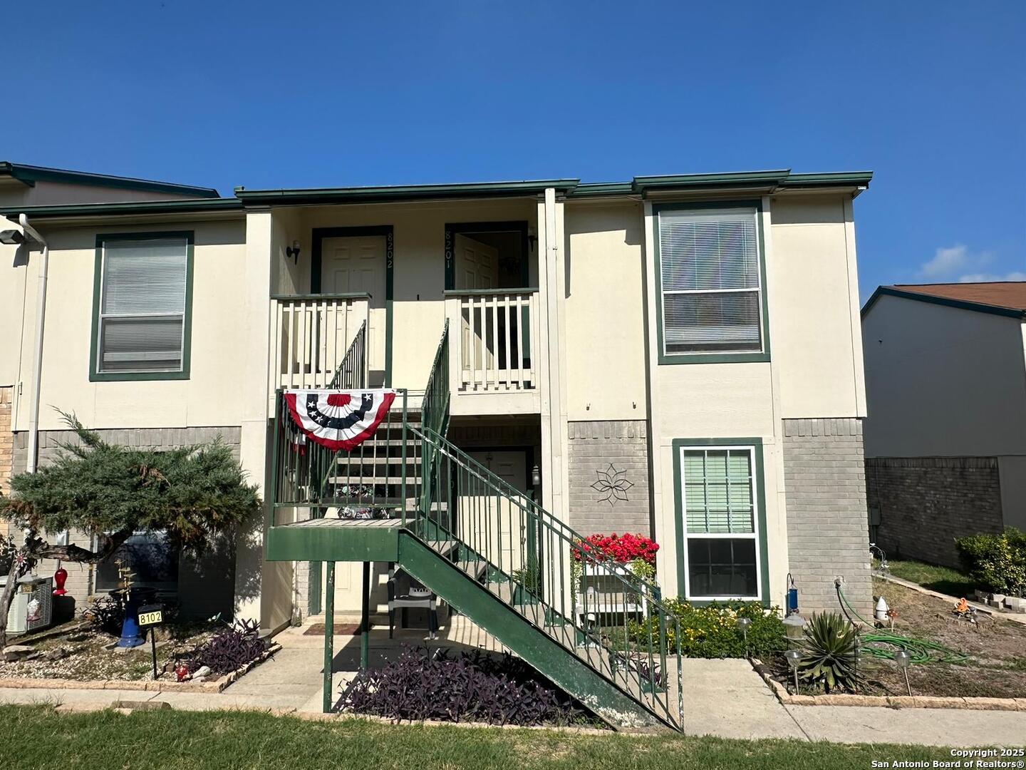 4949 Hamilton Wolfe Road, Unit 8201 San Antonio, TX 78229 - Photo 1 of 16 a front view of a house with a yard