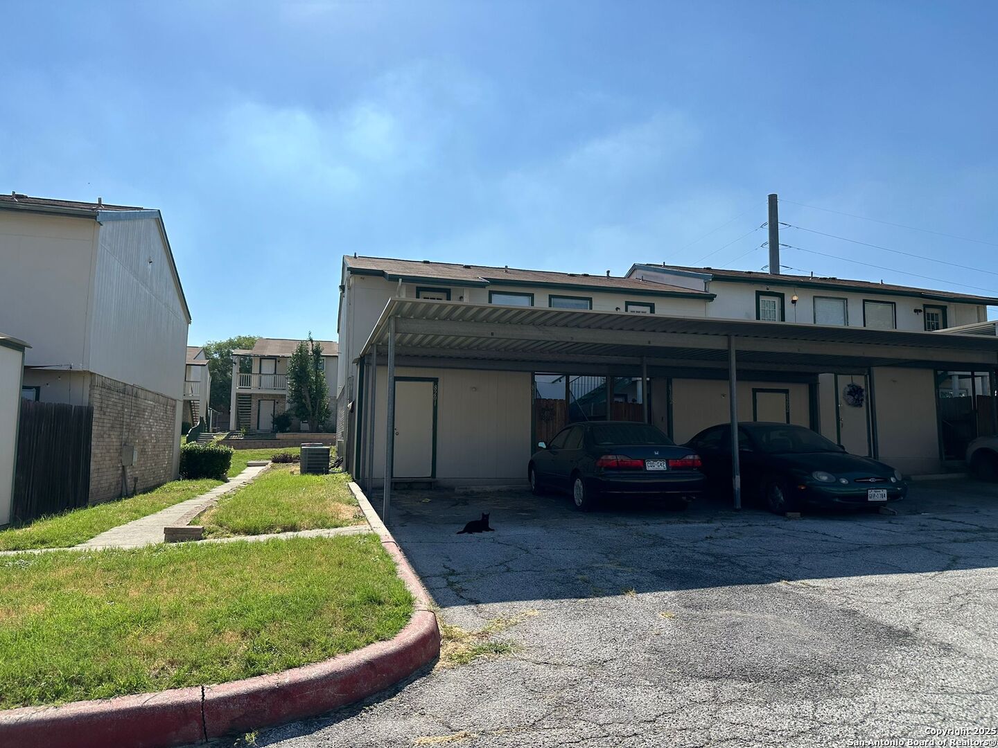 4949 Hamilton Wolfe Road, Unit 8201 San Antonio, TX 78229 - Photo 14 of 16 a view of a car park in front of house