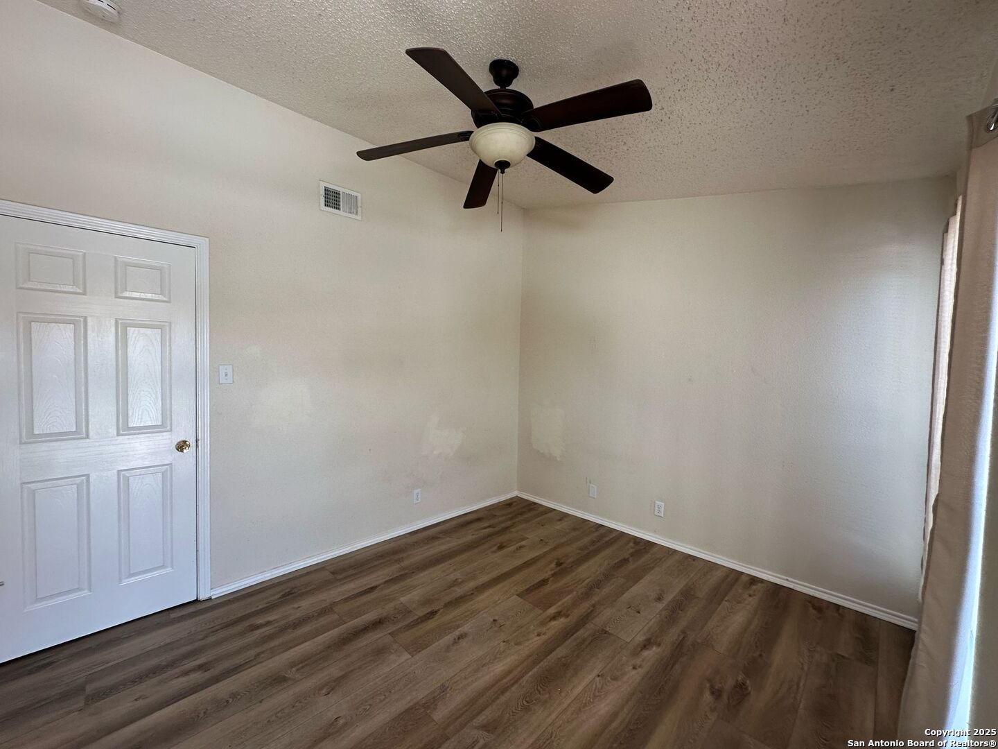 4949 Hamilton Wolfe Road, Unit 8201 San Antonio, TX 78229 - Photo 9 of 16 a view of empty room with wooden floor