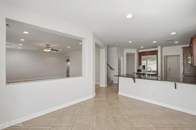 a large space with a large tub and chandelier