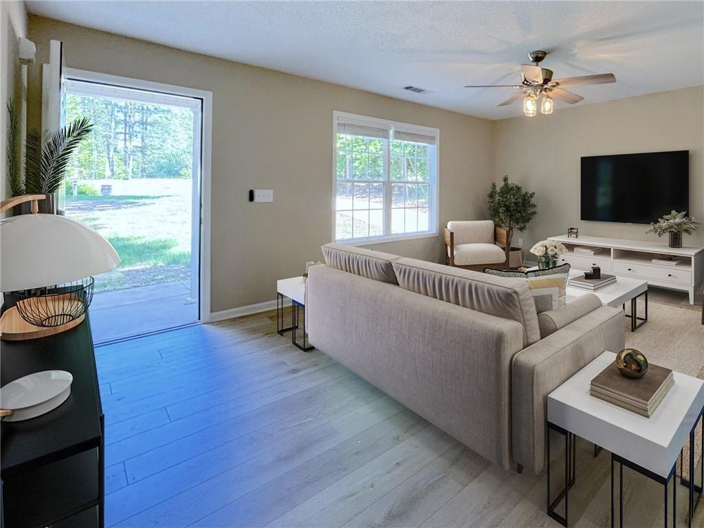 413 Old Brock Road Rockmart, GA 30153 - Photo 11 of 27 a living room with furniture and a flat screen tv
