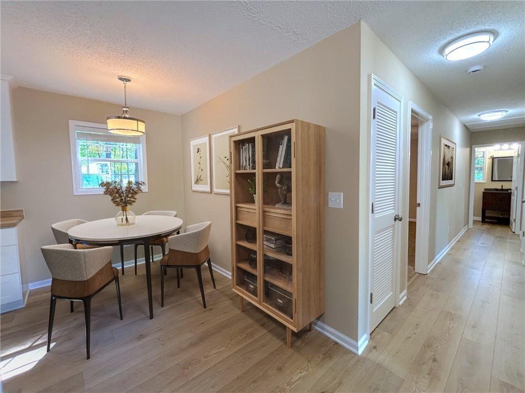 413 Old Brock Road Rockmart, GA 30153 - Photo 13 of 27 a view of a dining room with furniture and wooden floor