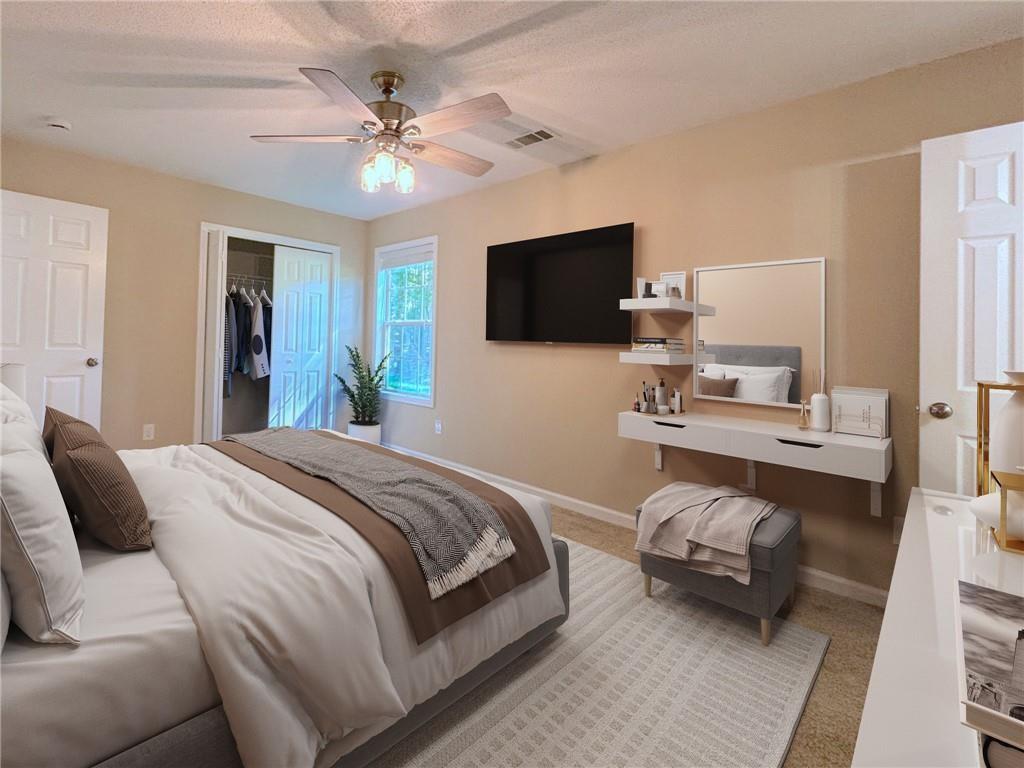 413 Old Brock Road Rockmart, GA 30153 - Photo 16 of 27 a bedroom with a bed and a flat screen tv