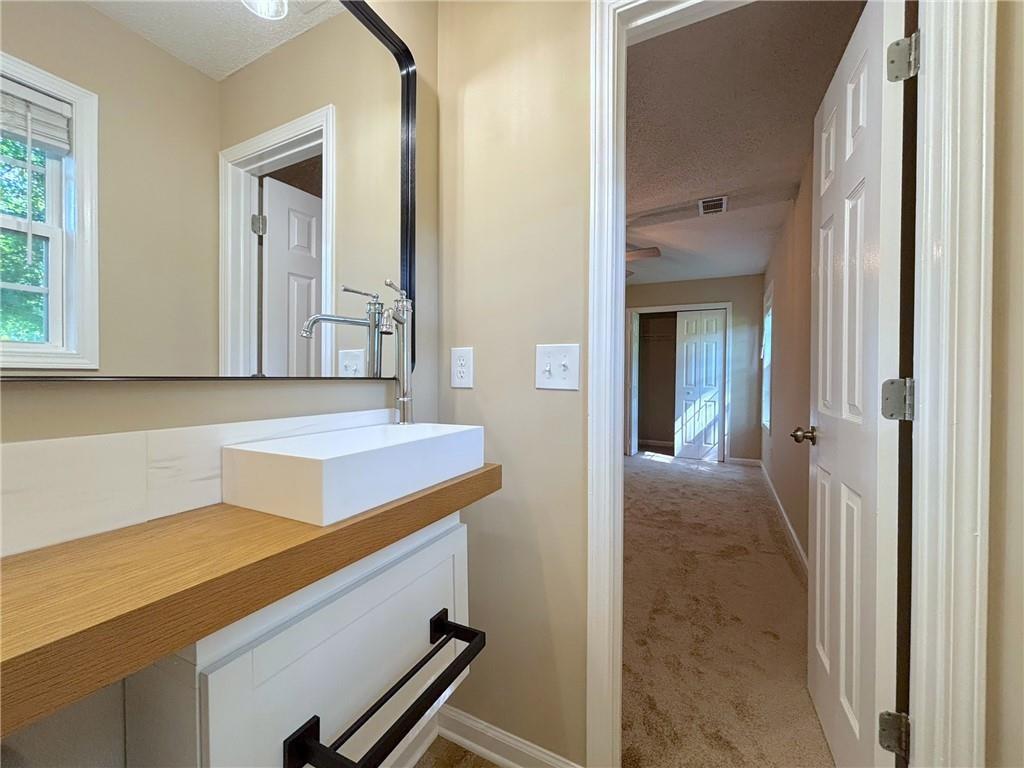 413 Old Brock Road Rockmart, GA 30153 - Photo 18 of 27 a bathroom with a sink and a mirror