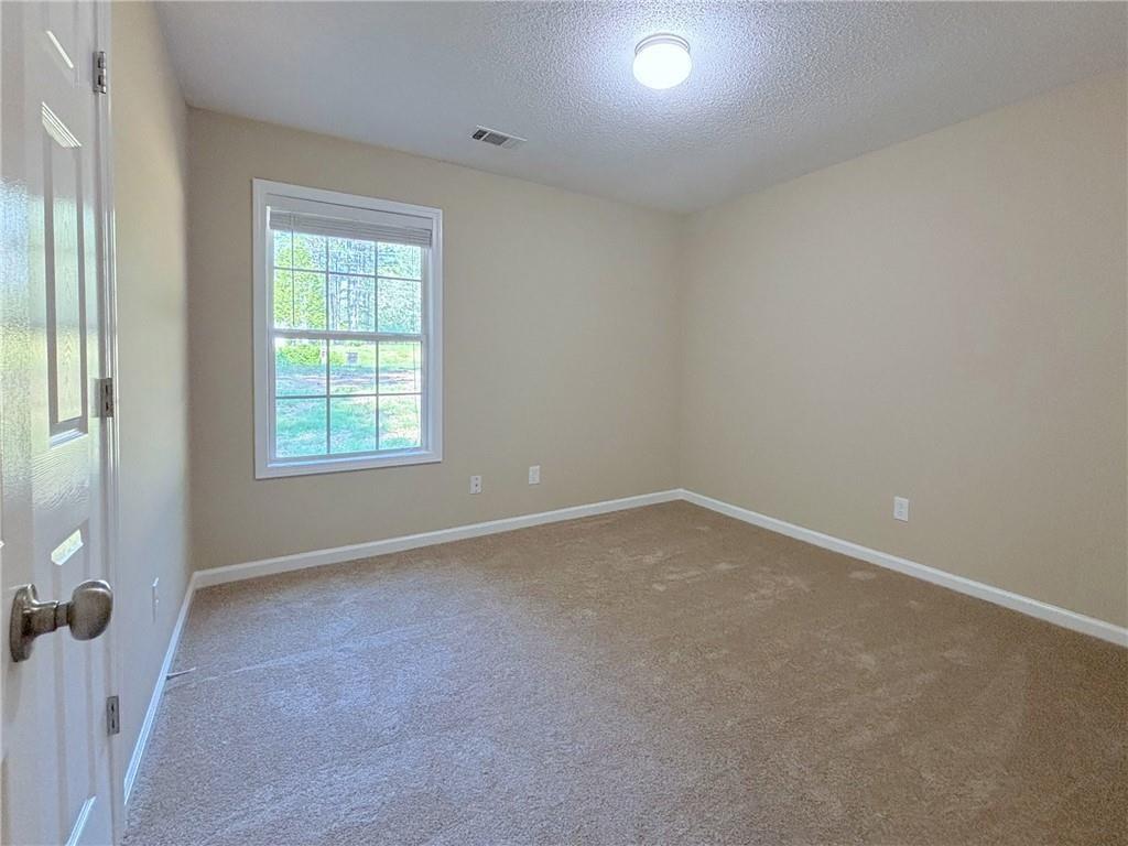 413 Old Brock Road Rockmart, GA 30153 - Photo 19 of 27 an empty room with windows