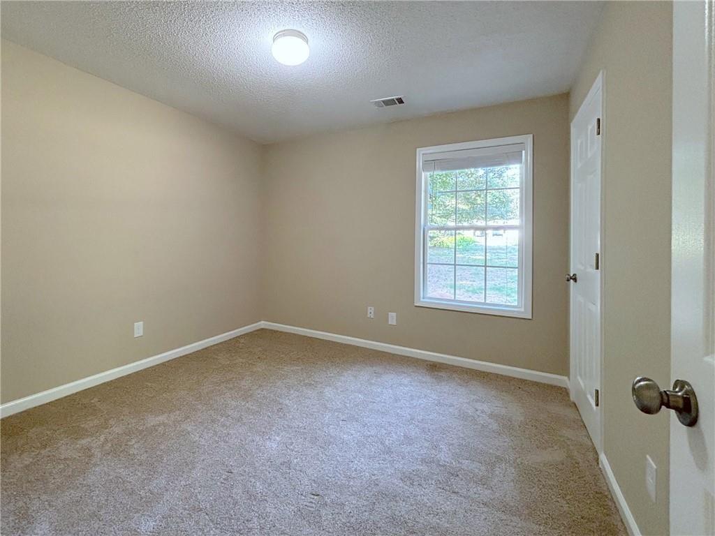 413 Old Brock Road Rockmart, GA 30153 - Photo 20 of 27 an empty room with a window