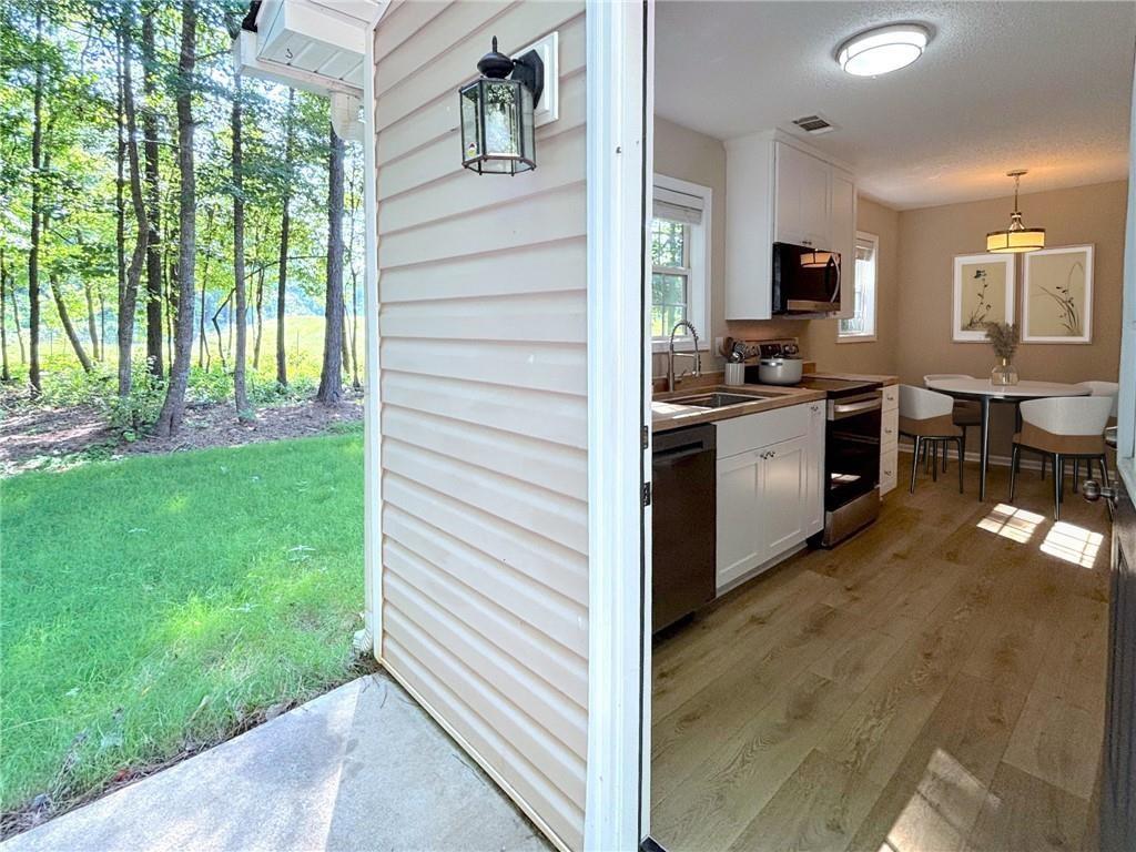 413 Old Brock Road Rockmart, GA 30153 - Photo 4 of 27 a kitchen with a sink and a stove top oven