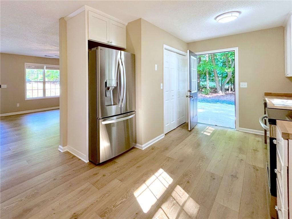 413 Old Brock Road Rockmart, GA 30153 - Photo 7 of 27 a kitchen with a refrigerator and window