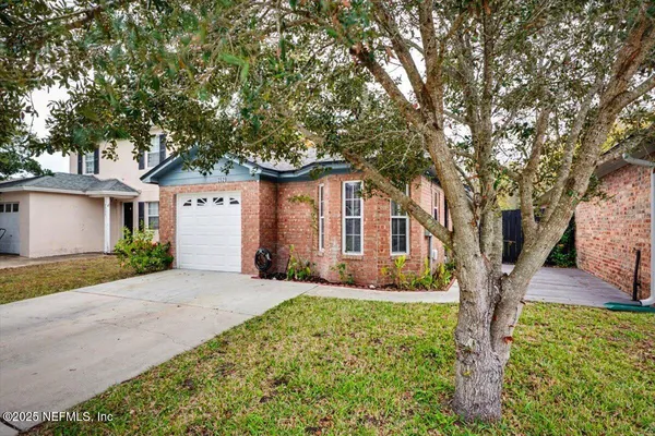 front view of a house with a yard