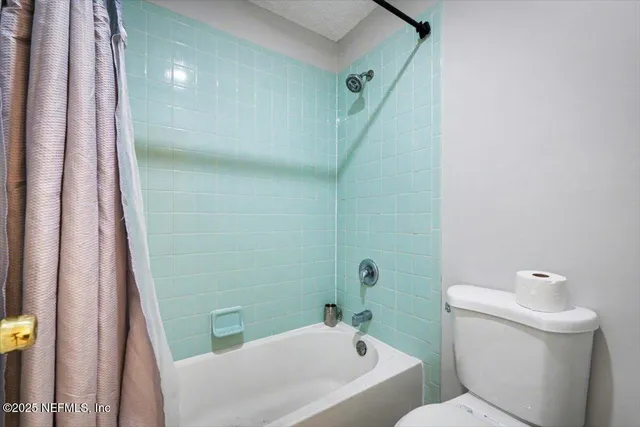 a bathroom with a sink and toilet