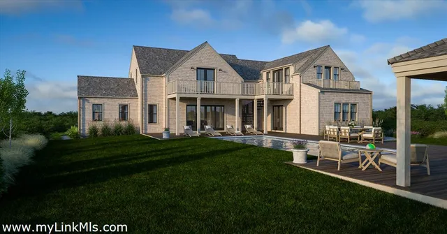 a front view of a house with a garden and patio