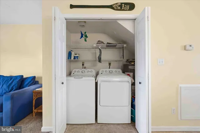 a bathroom with a sink mirror vanity and toilet