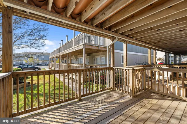 a view of an empty room with a ceiling fan