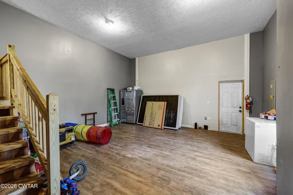 a room with furniture and a flat screen tv
