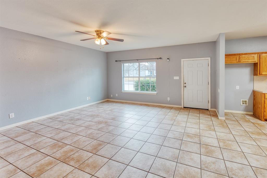 216 East Walcott Street Pilot Point, TX 76258 - Photo 2 of 12 a view of an empty room with a window