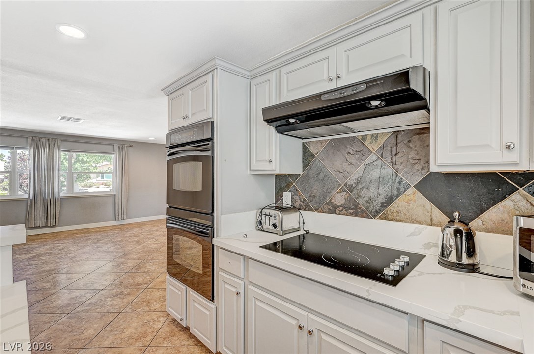 4153 Woodcrest Road Las Vegas, NV 89121 - Photo 15 of 58 A well-equipped culinary space awaits with modern appliances and ample preparation areas.