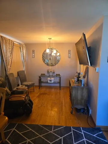 a room with furniture and air hockey table