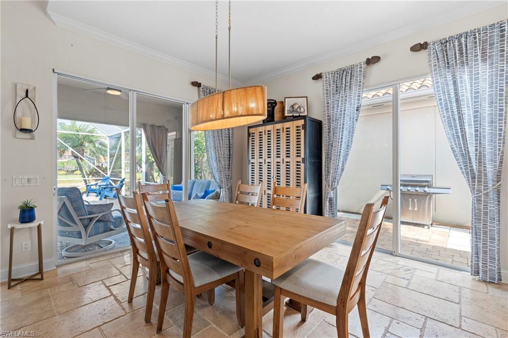 4401 Novato Court Naples, FL 34109 - Photo 20 of 50 a view of a dining room with furniture window and outside view