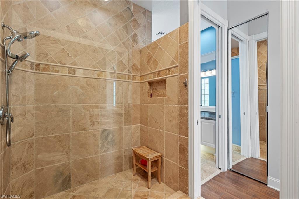 4401 Novato Court Naples, FL 34109 - Photo 26 of 50 a bathroom with a shower and a sink