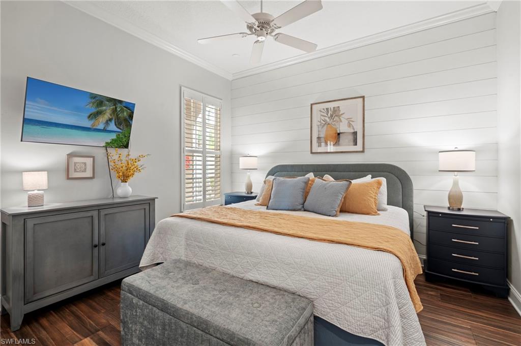 4401 Novato Court Naples, FL 34109 - Photo 29 of 50 a bedroom with a bed and a dresser