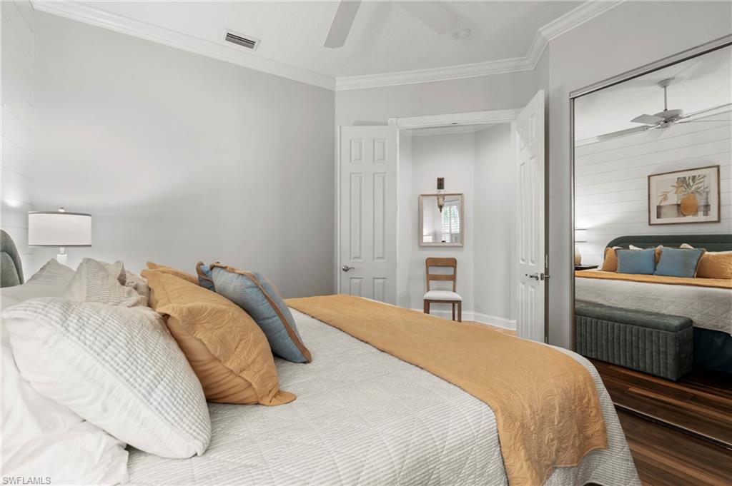 4401 Novato Court Naples, FL 34109 - Photo 30 of 50 a bedroom with a bed and a view of bedroom