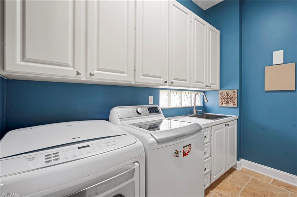 4401 Novato Court Naples, FL 34109 - Photo 37 of 50 a utility room with dryer and washer