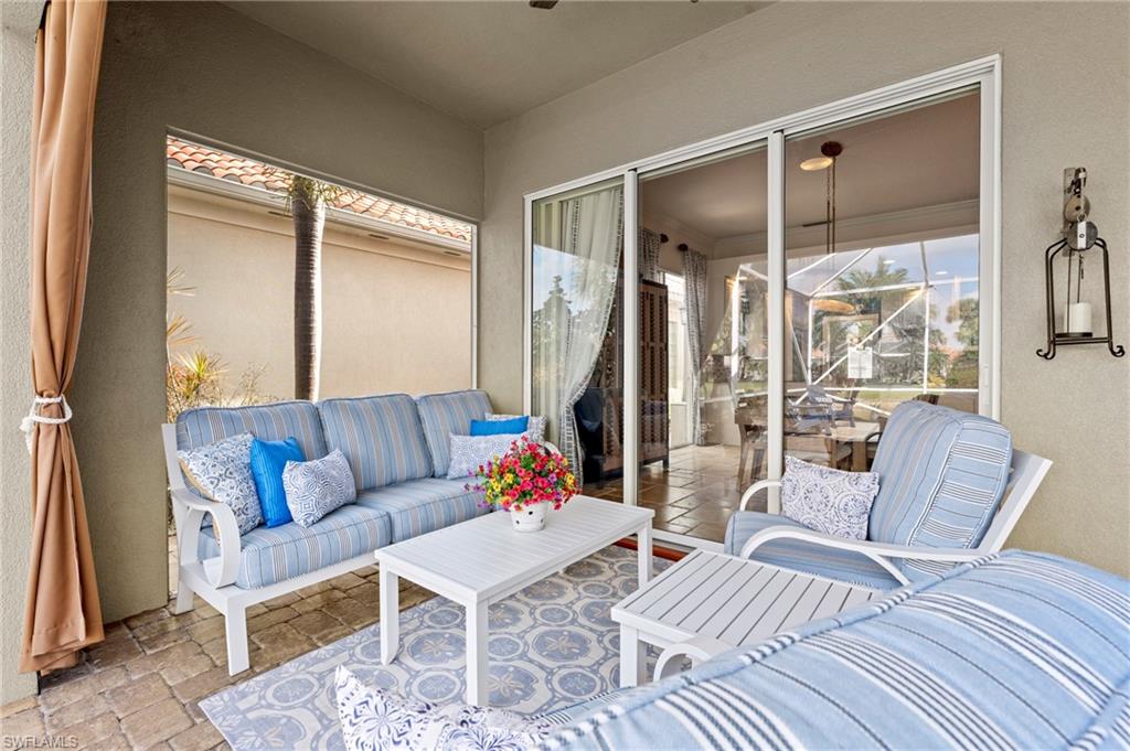 4401 Novato Court Naples, FL 34109 - Photo 40 of 50 a living room with furniture and a large window