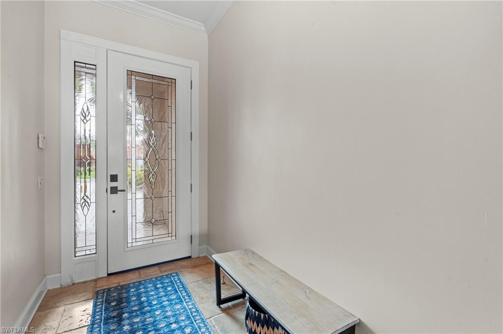 4401 Novato Court Naples, FL 34109 - Photo 7 of 50 a view of room with window and entryway