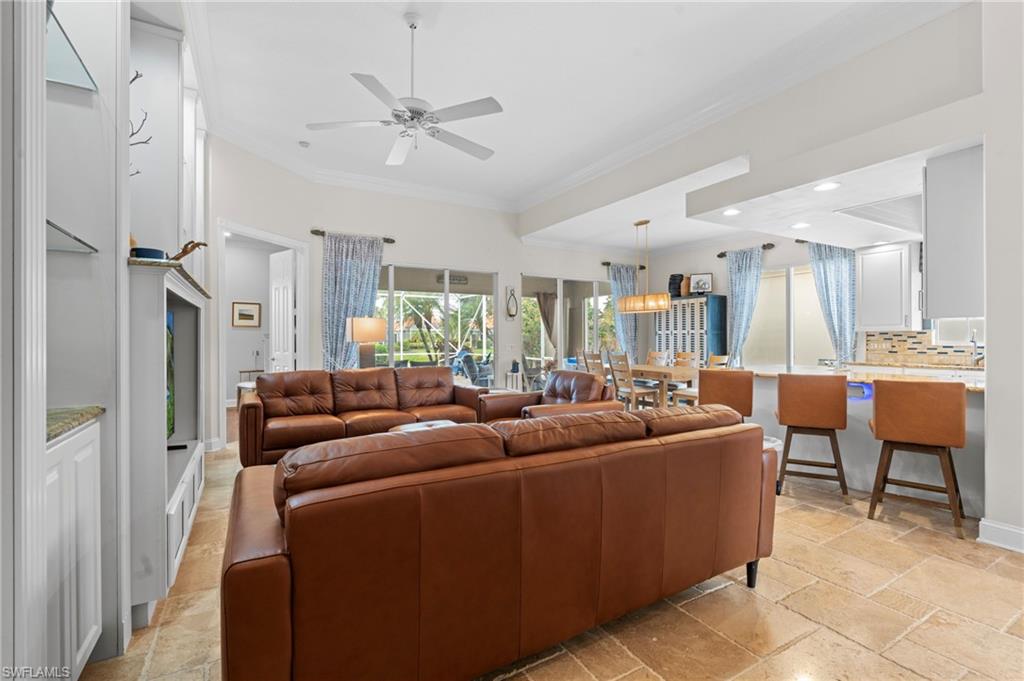 4401 Novato Court Naples, FL 34109 - Photo 10 of 50 a living room with furniture and a large window