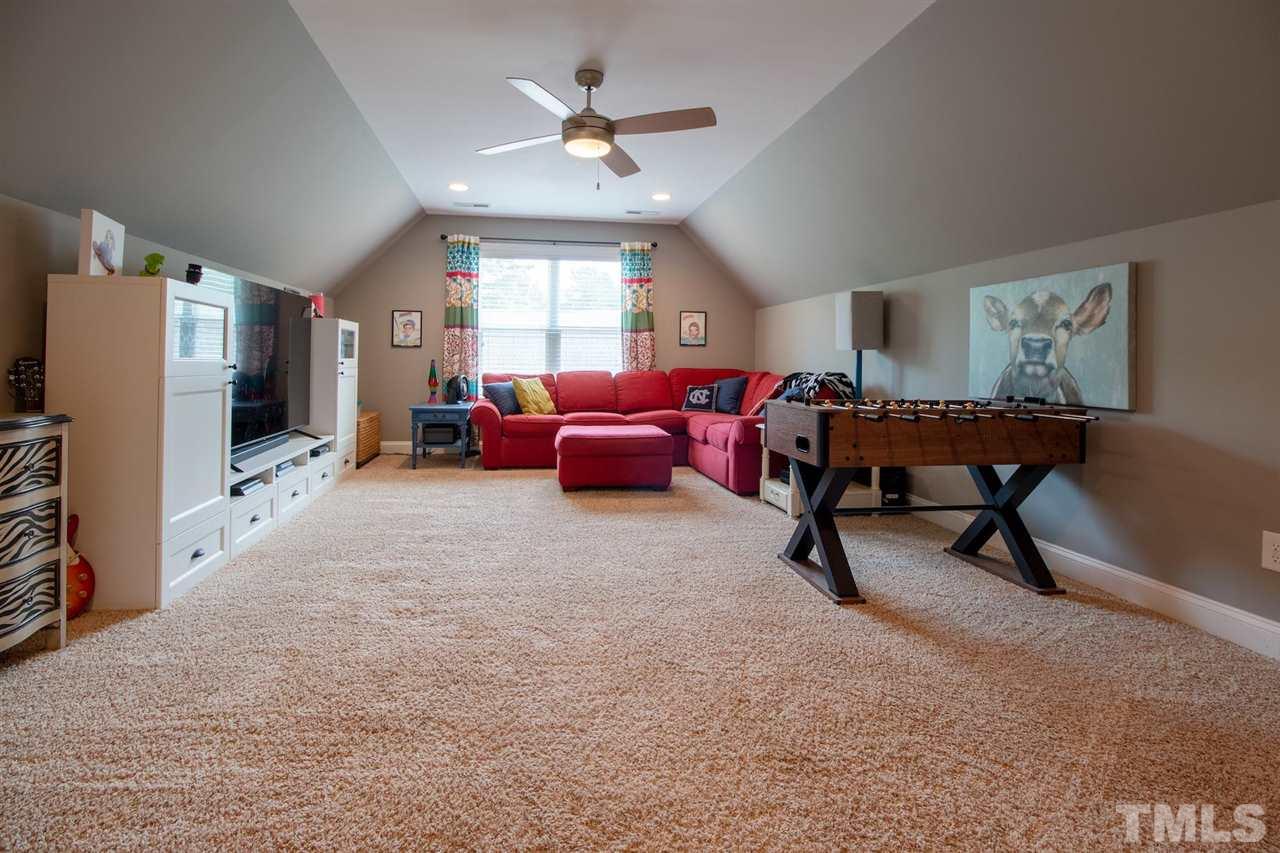 2637 Mt Vernon Church Road Raleigh, NC 27614 - Photo 13 of 15 a view of a livingroom with furniture window and a ceiling fan