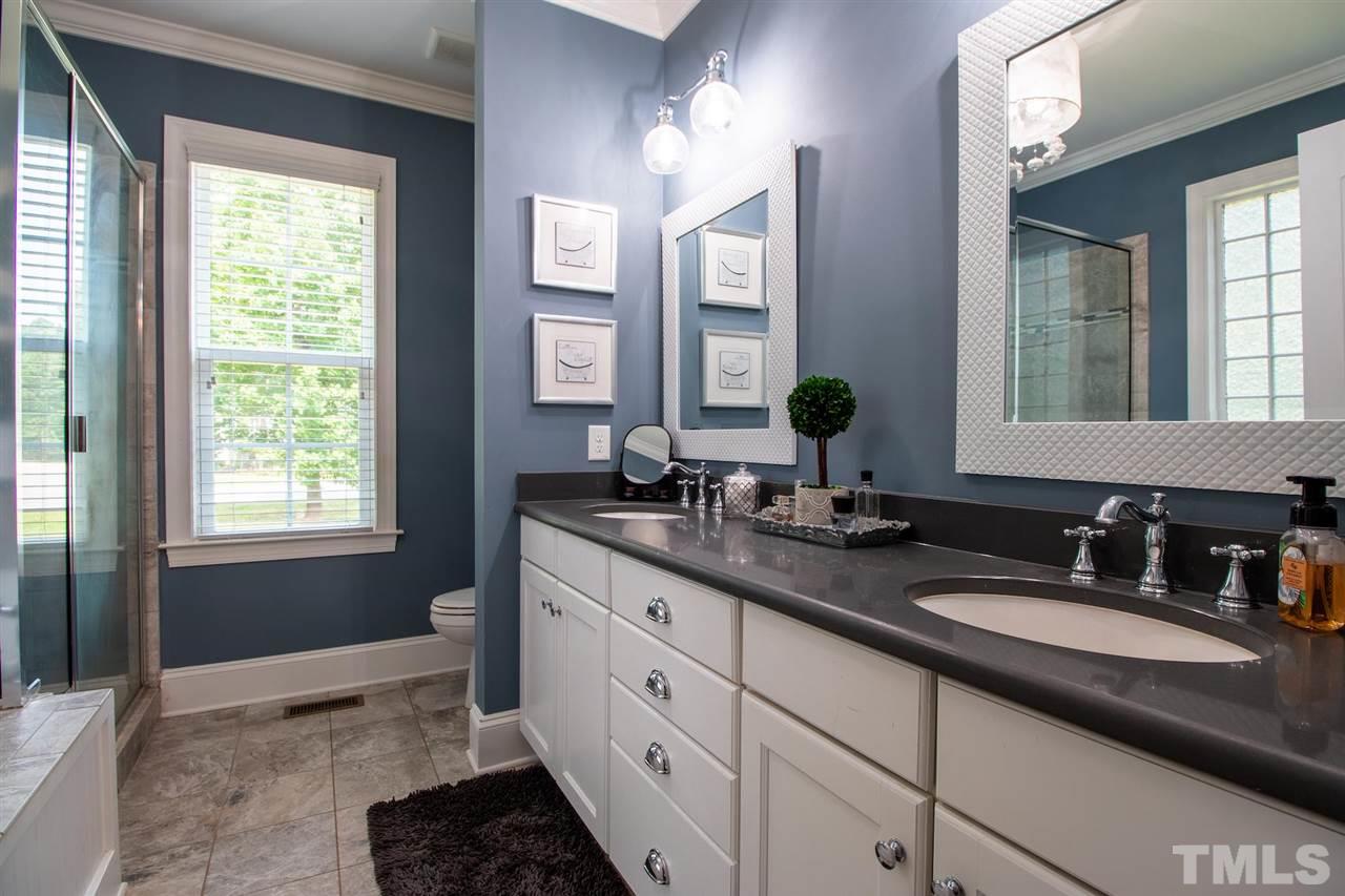 2637 Mt Vernon Church Road Raleigh, NC 27614 - Photo 9 of 15 a bathroom with double sink and a mirror