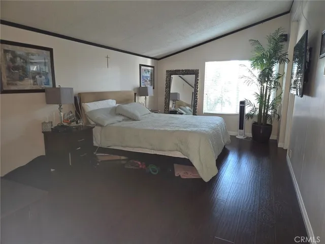 a living room with furniture window and wooden floor