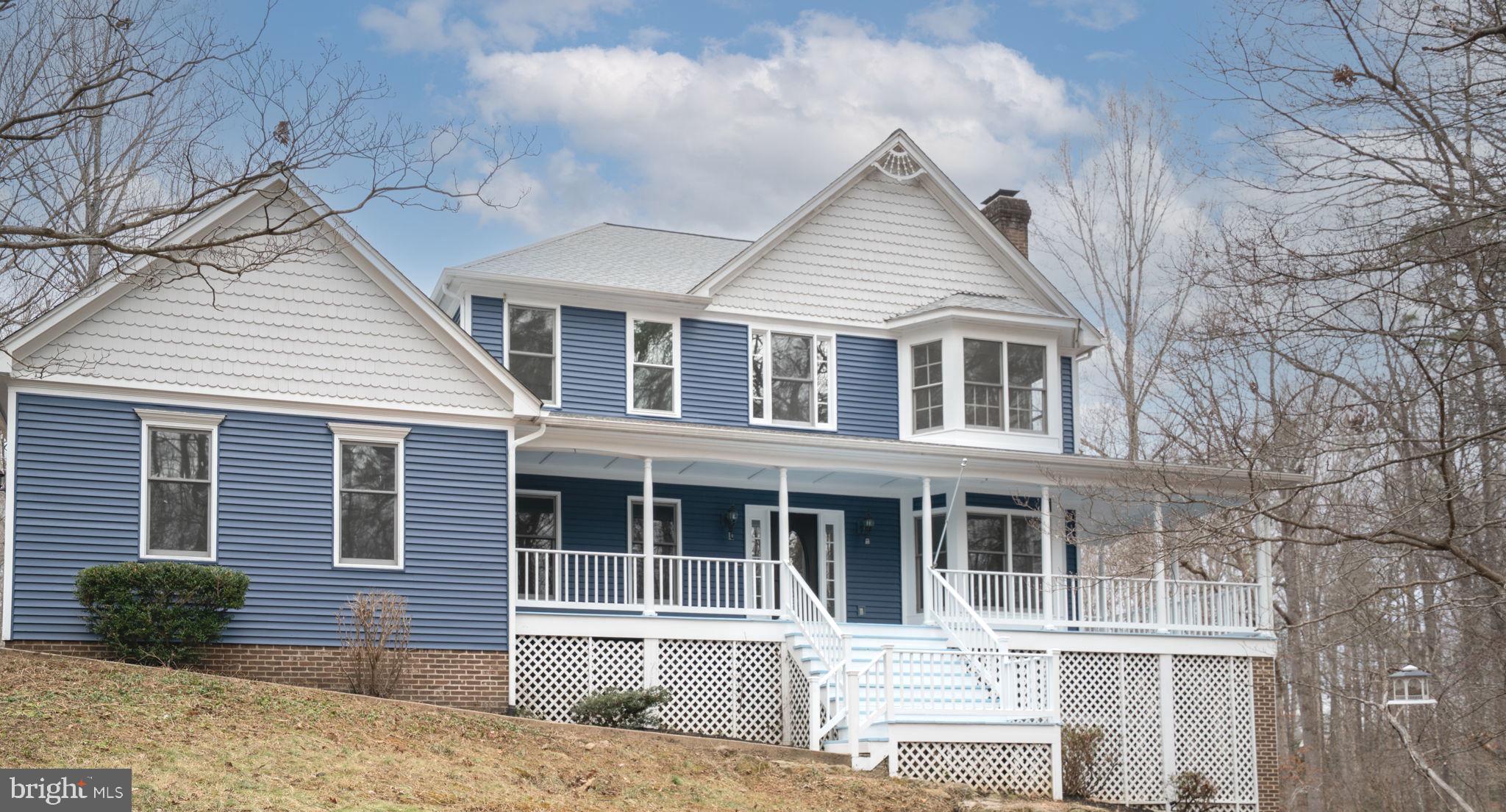 8261 Tinsley Place Culpeper, VA 22701 - Photo 1 of 80 a front view of a house with a yard