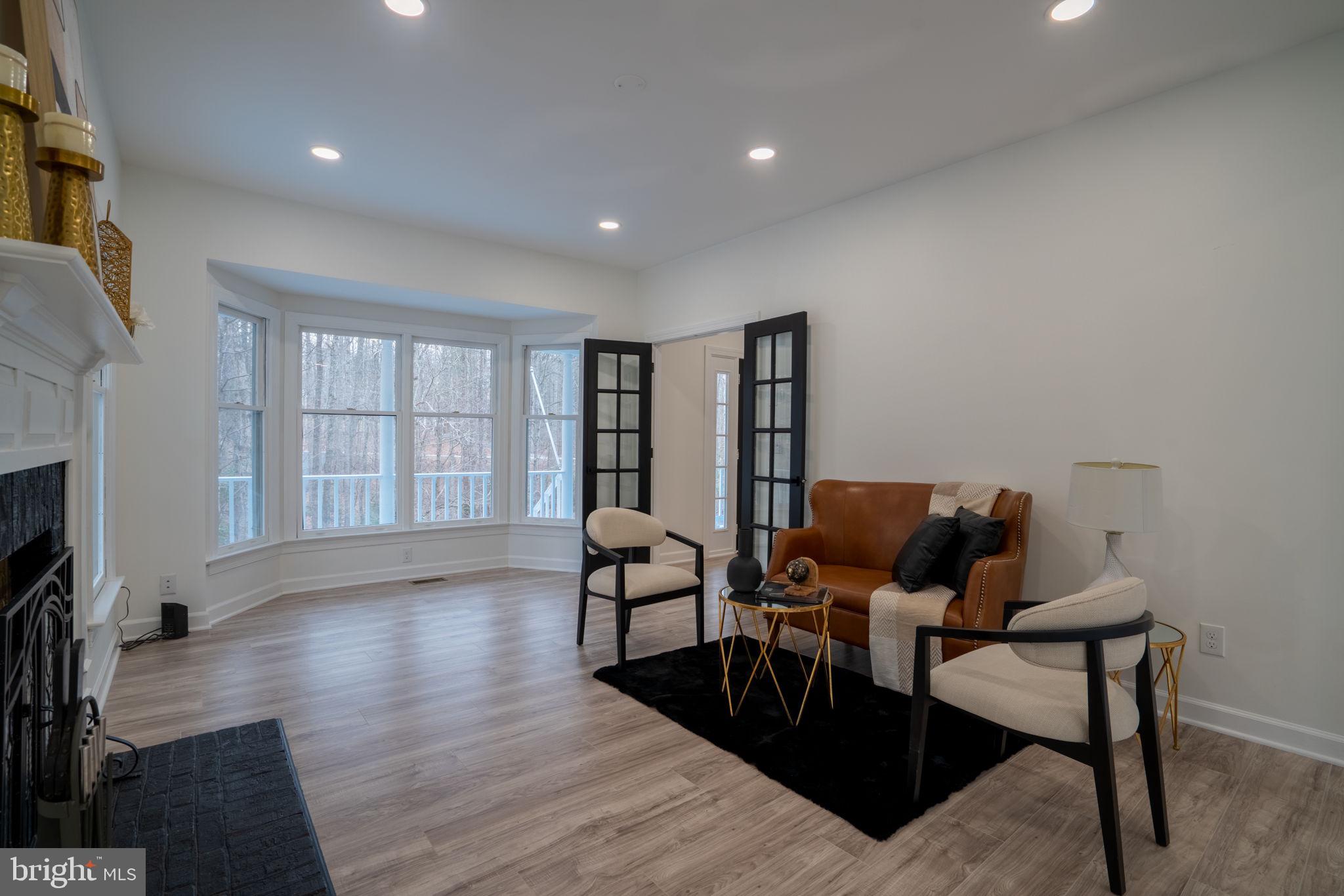 8261 Tinsley Place Culpeper, VA 22701 - Photo 27 of 80 a living room with furniture and a flat screen tv