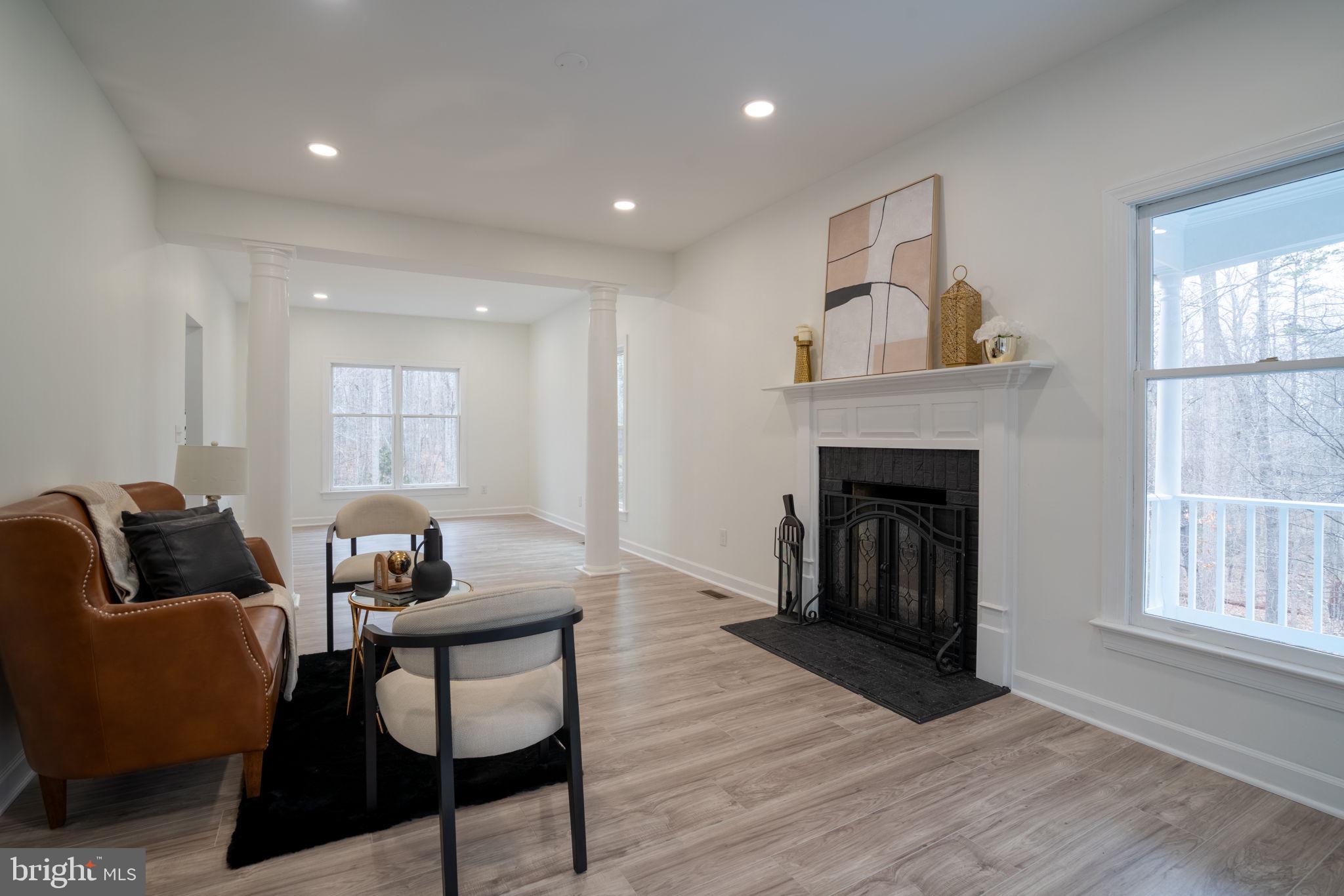 8261 Tinsley Place Culpeper, VA 22701 - Photo 28 of 80 a living room with furniture and a fireplace