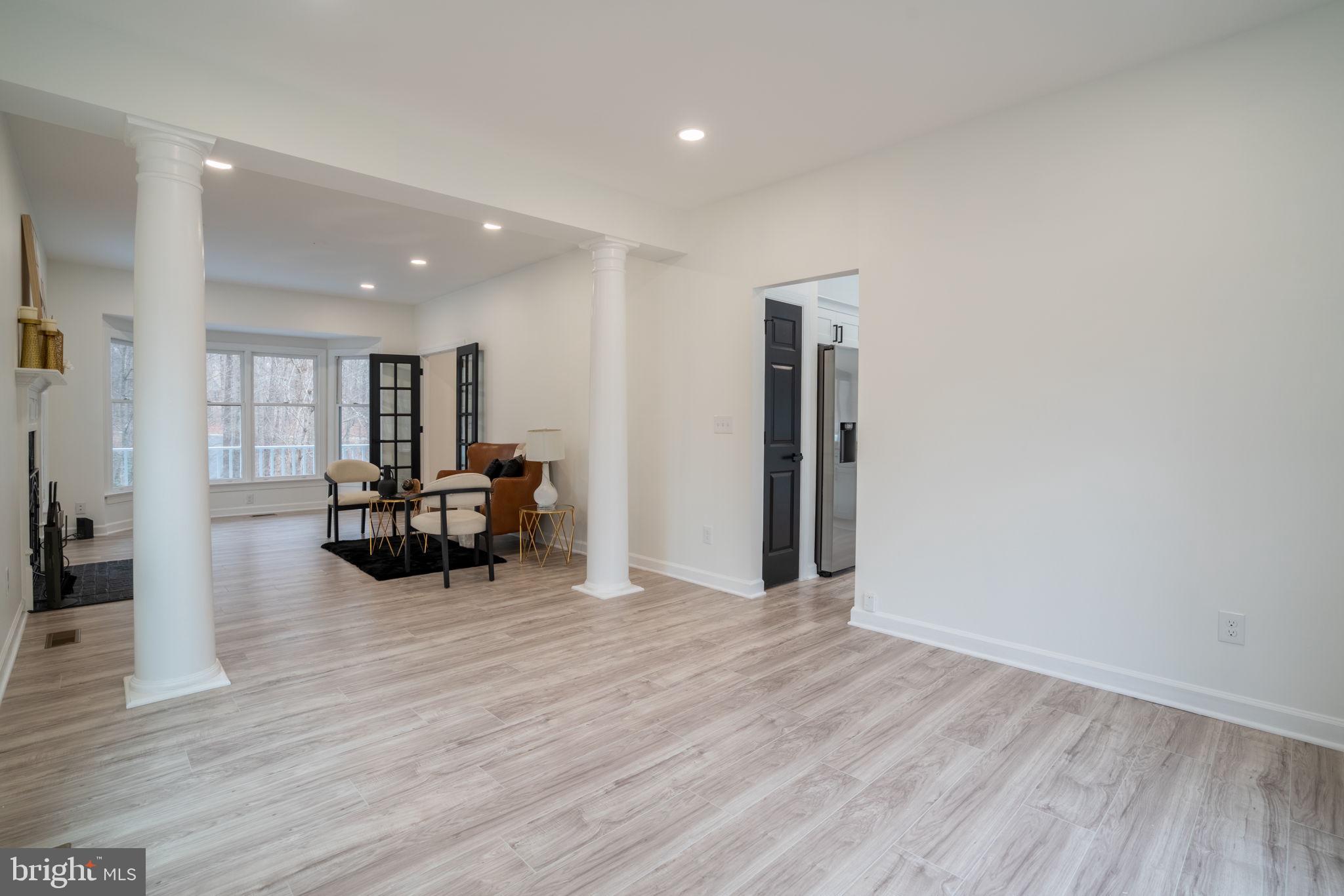 8261 Tinsley Place Culpeper, VA 22701 - Photo 31 of 80 a view of living room with furniture and a wooden floor